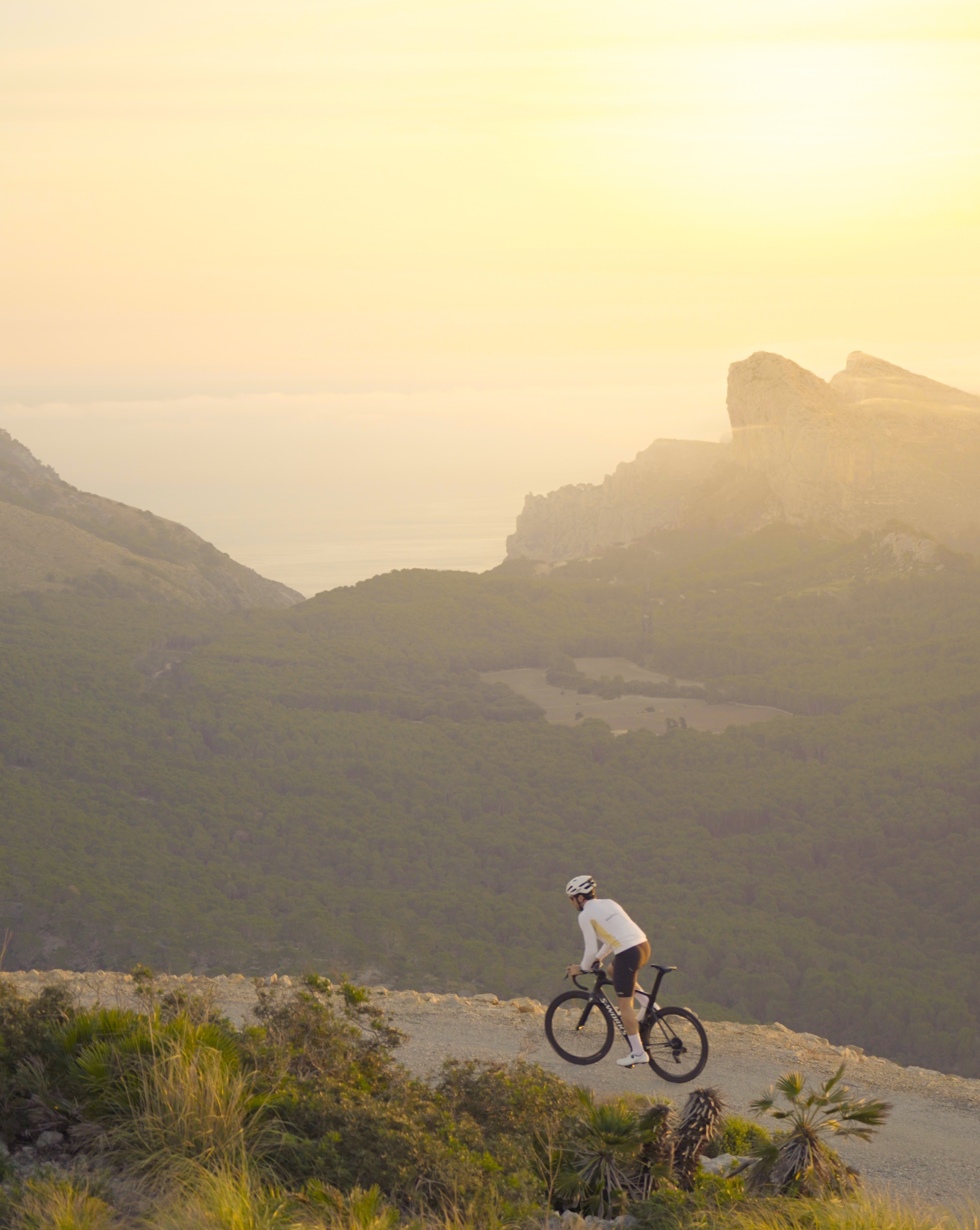 Cyclist riding with stunning views of Formentor