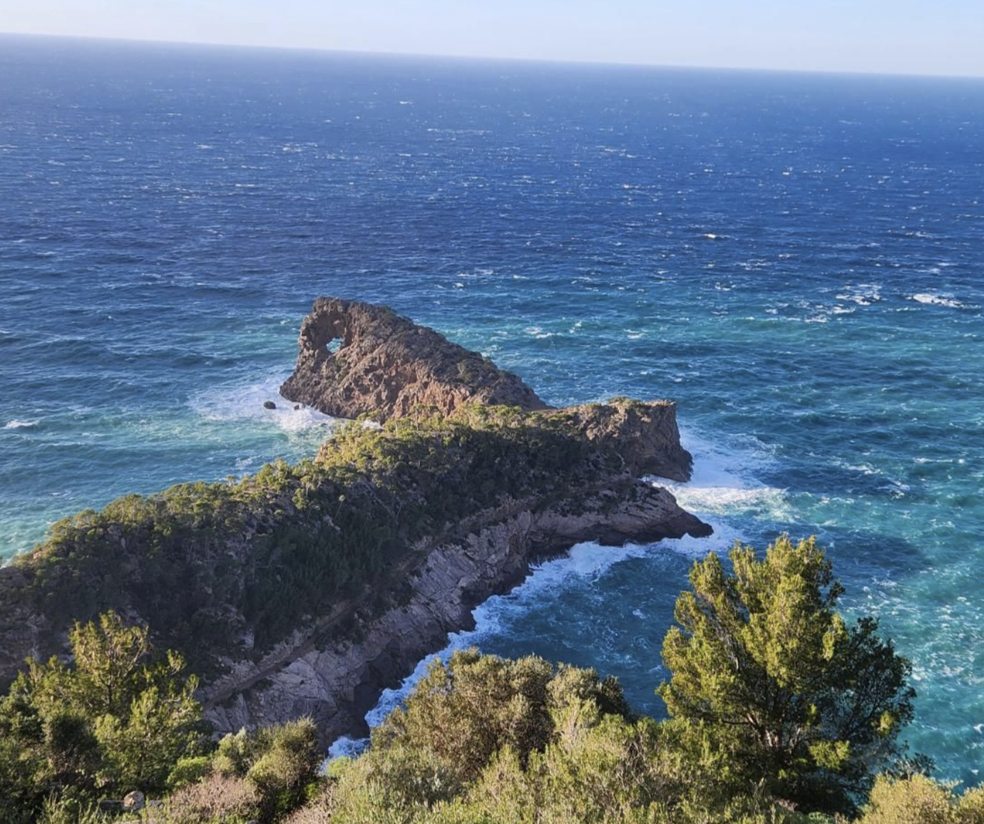 Sa Foradada rock arch on the coastline below Deià, Mallorca