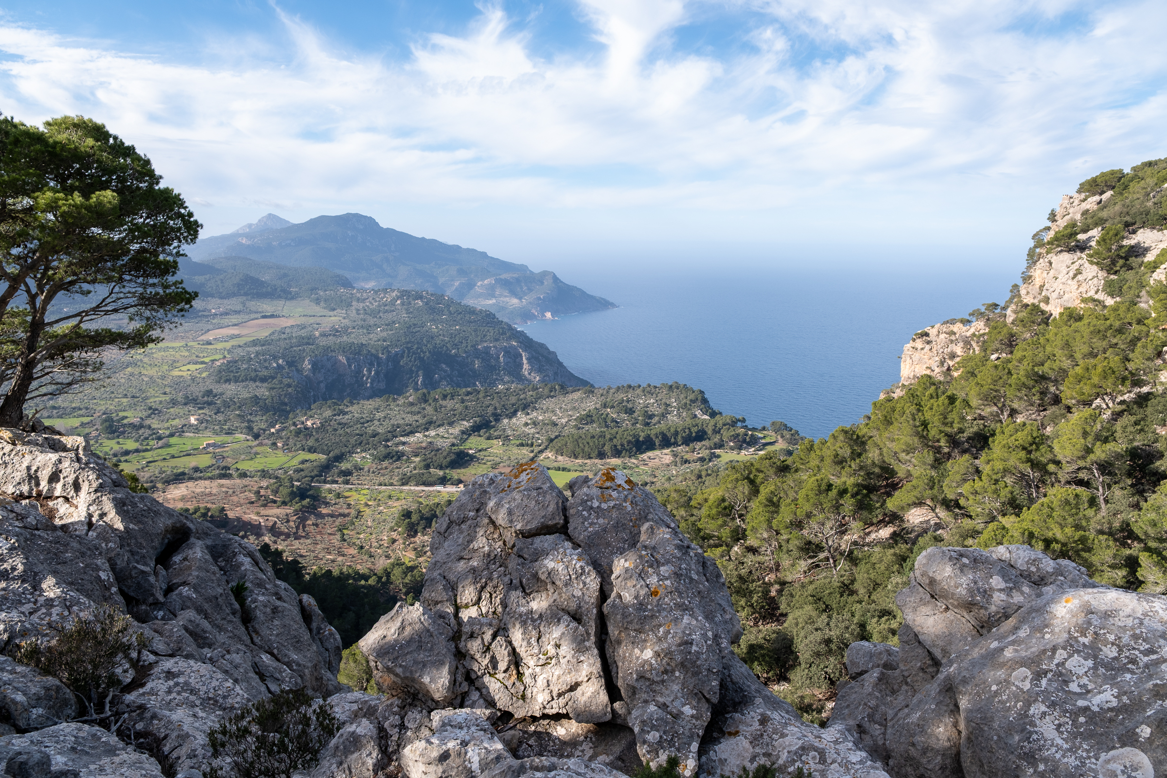 Hikers on the Camí de l'Arxiduc above Deià, Serra de Tramuntana