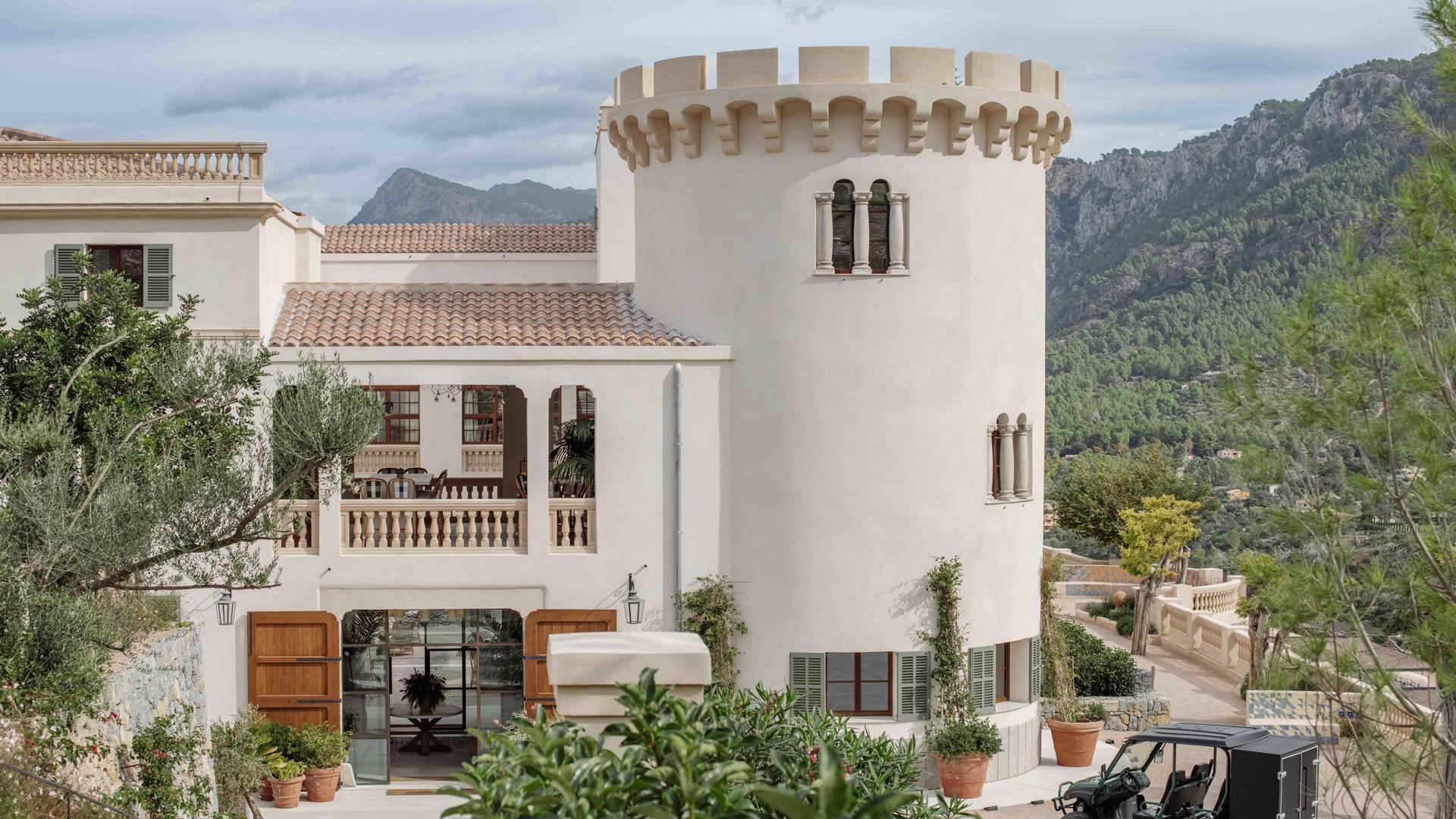 A boutique hotel terrace in Mallorca set for a long lunch, the kind of setting where a leadership conversation continues off the bike